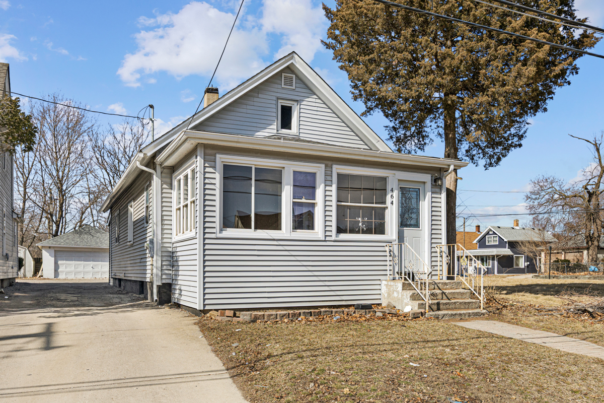 464 Prospect Boulevard Elgin, IL 60120 - Photo 1 of 17 a front view of a house with a yard