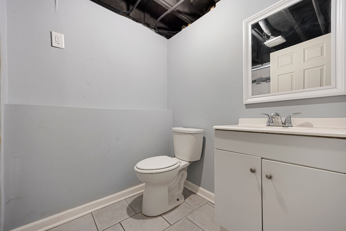 464 Prospect Boulevard Elgin, IL 60120 - Photo 11 of 17 a bathroom with a sink toilet and vanity