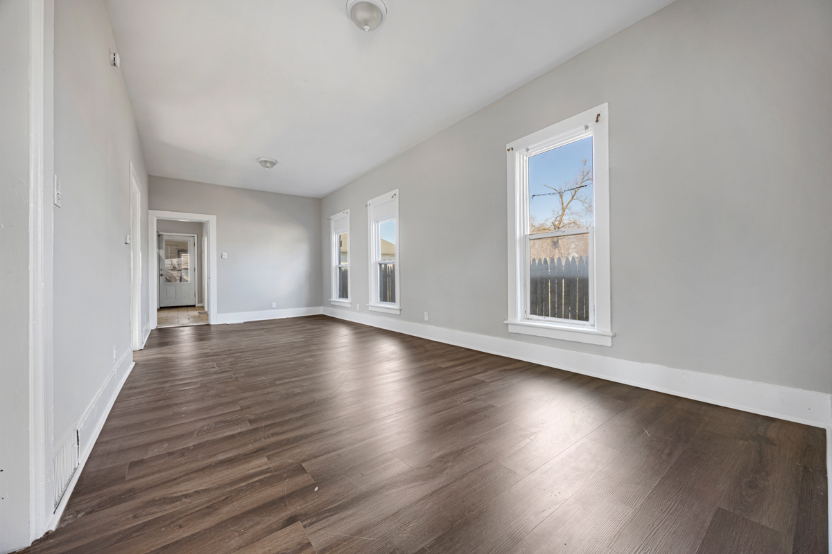 464 Prospect Boulevard Elgin, IL 60120 - Photo 3 of 17 an empty room with wooden floor and windows
