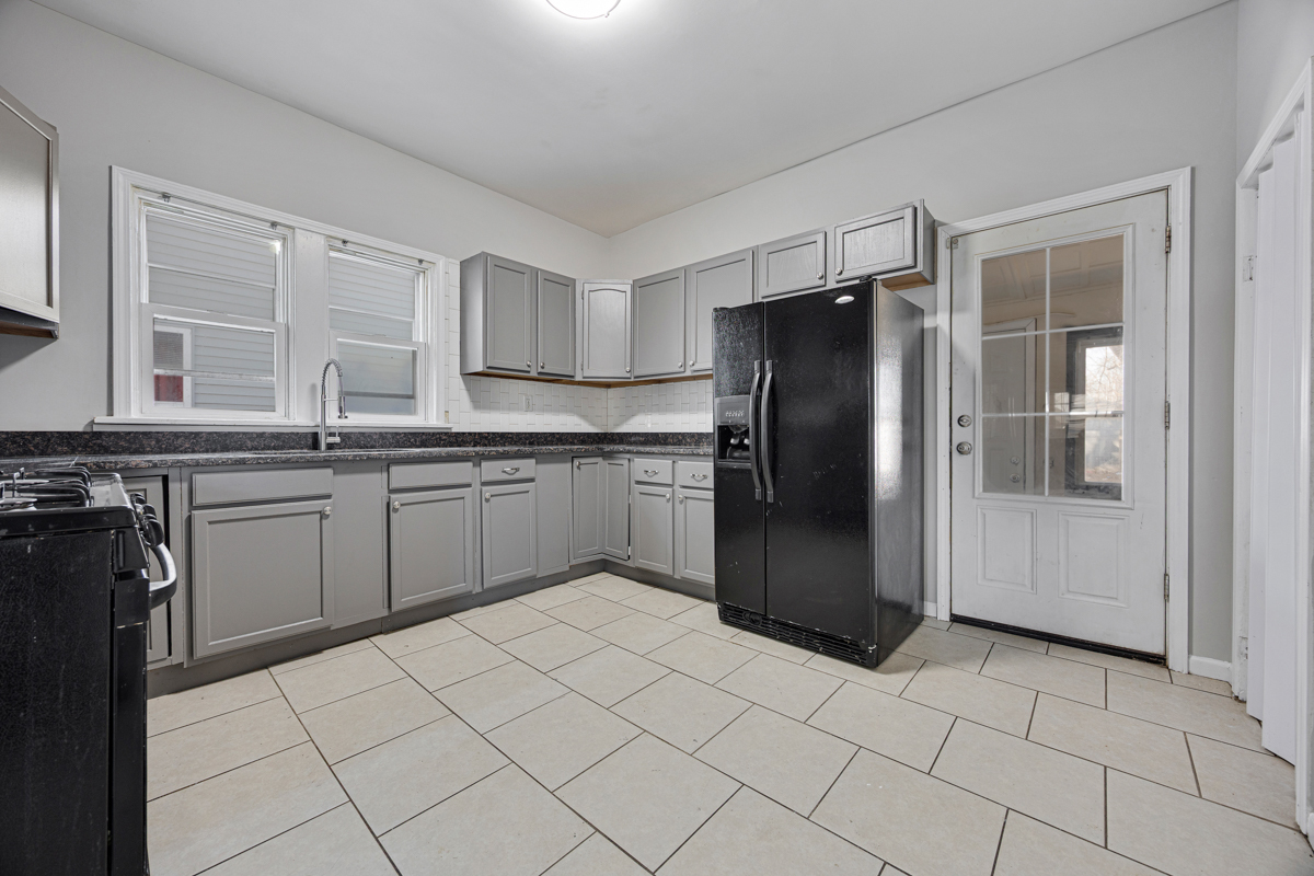 464 Prospect Boulevard Elgin, IL 60120 - Photo 8 of 17 a kitchen with stainless steel appliances granite countertop a refrigerator and a sink