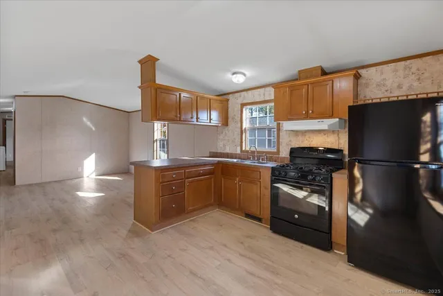 a kitchen with a refrigerator stove and sink