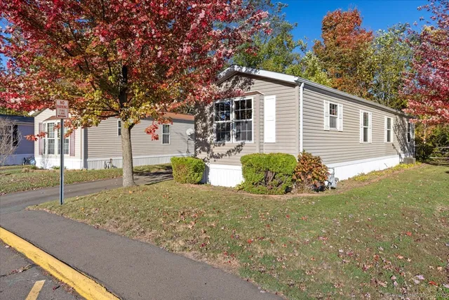 a view of a house with a yard