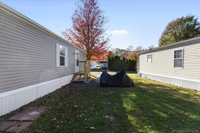 a view of a backyard with large trees