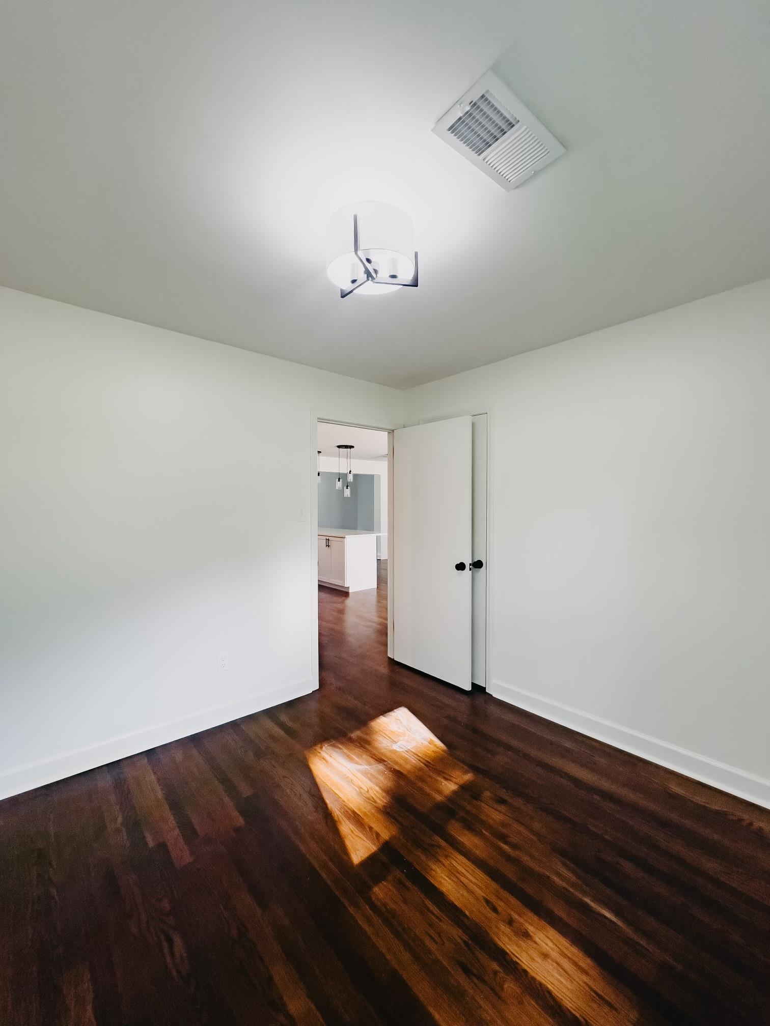 8515 Epperson Mill Road Millington, TN 38053 - Photo 19 of 32 Empty room featuring dark wood-type flooring