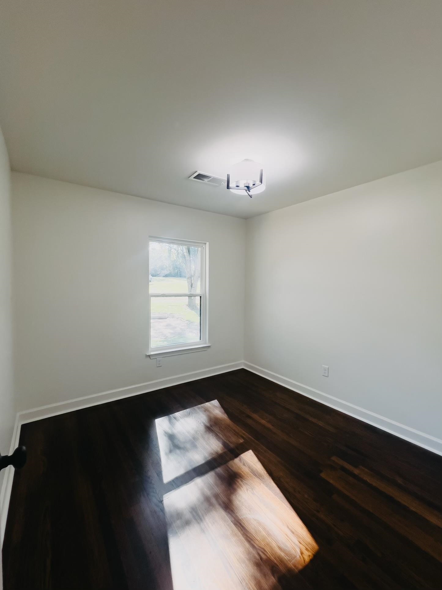 8515 Epperson Mill Road Millington, TN 38053 - Photo 21 of 32 Spare room with dark hardwood / wood-style floors