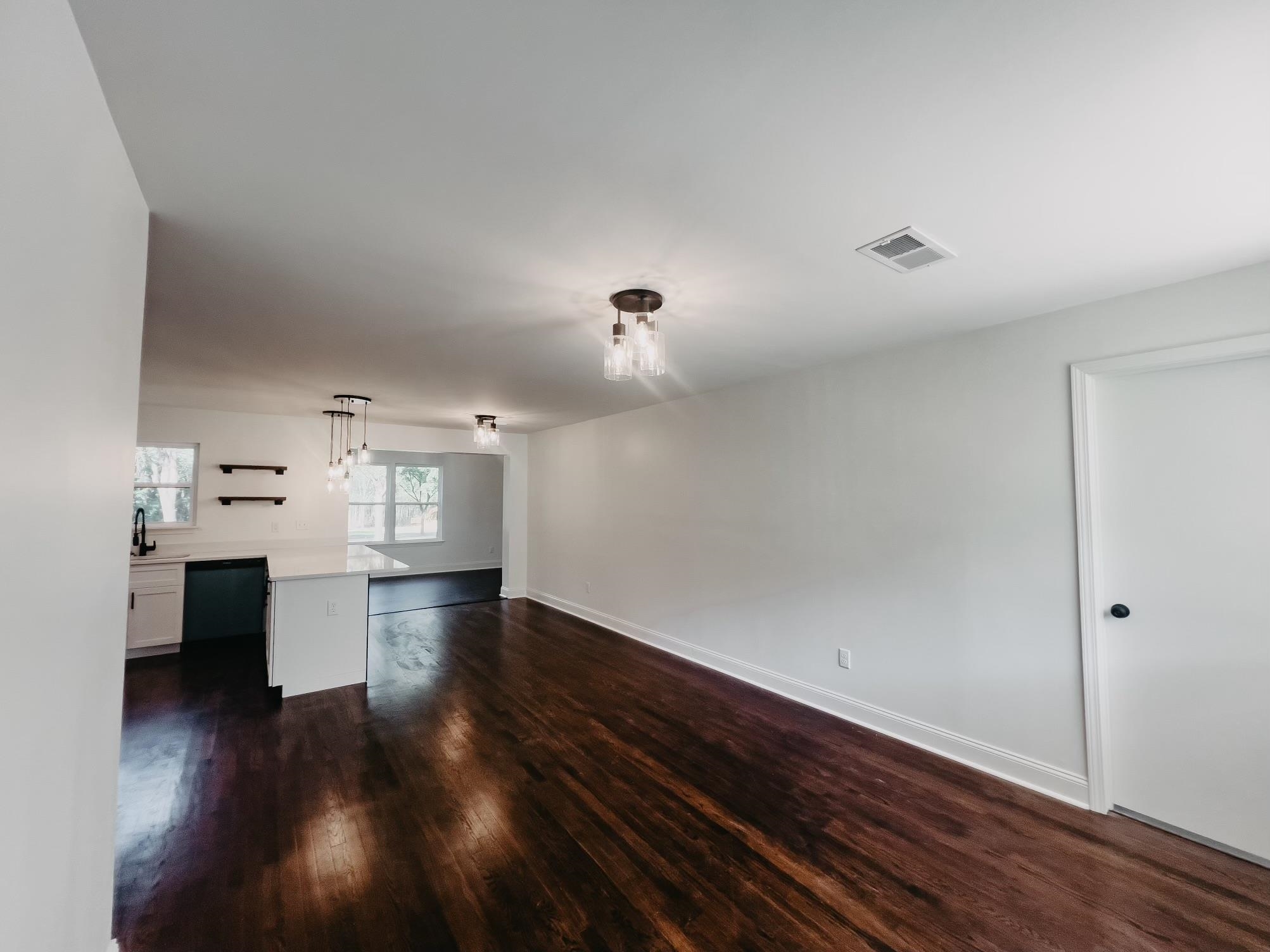 8515 Epperson Mill Road Millington, TN 38053 - Photo 5 of 32 Unfurnished living room with sink and dark wood-type flooring