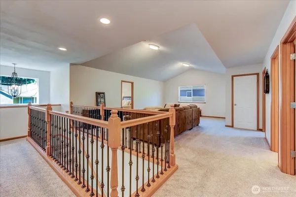 a view of a bedroom with furniture and windows