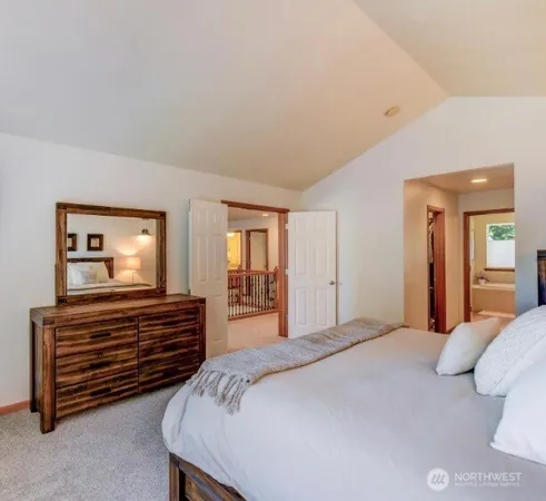 a bedroom with a bed and a dresser