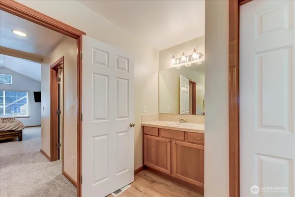 a en suite bathroom with a sink and a mirror