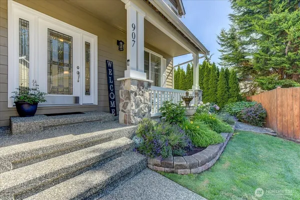 a front view of a house with garden