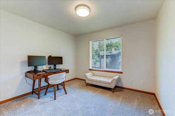 a bedroom with a workspace