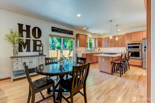 a dining room with furniture and window