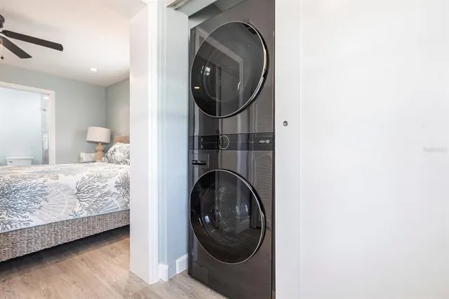 a bedroom with a sink and a washer