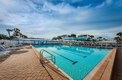 6020 Midnight Pass Road, Unit 64 Sarasota, FL 34242 - Photo 14 of 14 a view of a swimming pool and an ocean view
