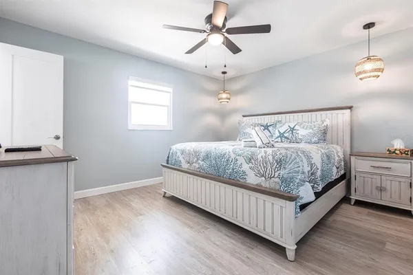 a bedroom with bed and window