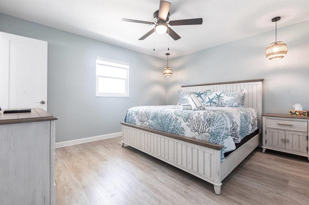 6020 Midnight Pass Road, Unit 64 Sarasota, FL 34242 - Photo 8 of 14 a bedroom with bed and window
