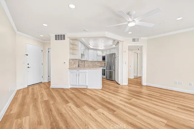 a view of kitchen with wooden floor and window