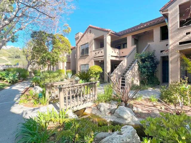 a view of a park with an ocean