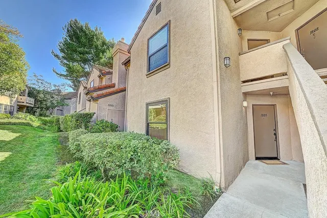 a view of a house with a small yard
