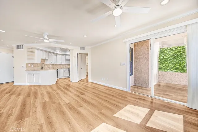 a view of a kitchen with a sink and a window