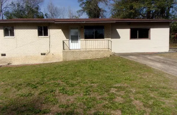 a house with trees in the background