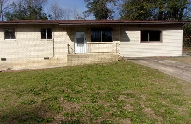 a house with trees in the background