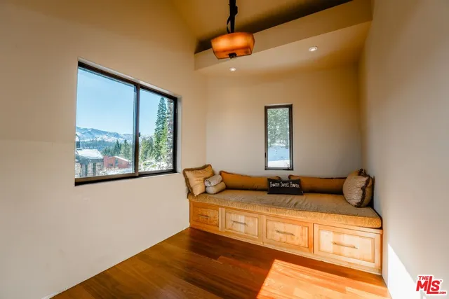 a view of staircase with railing and white walls