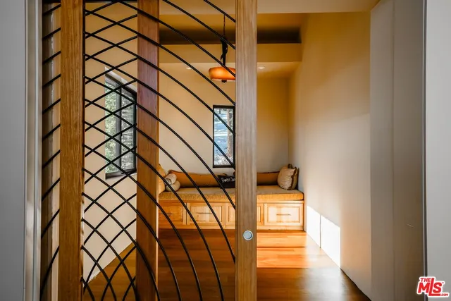 a spacious bedroom with a large bed and a large window