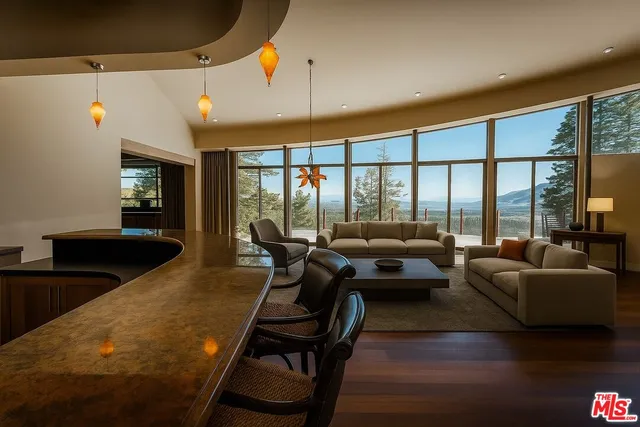 a spacious bathroom with a granite countertop sink a mirror and a refrigerator