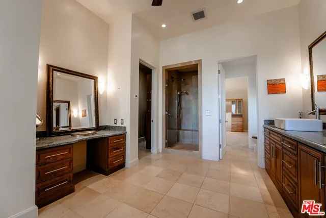 a bathroom with a glass shower door