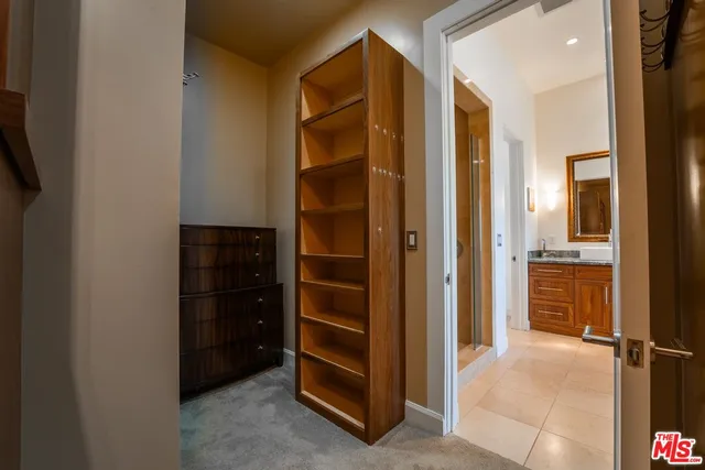 a front view of a house with plants