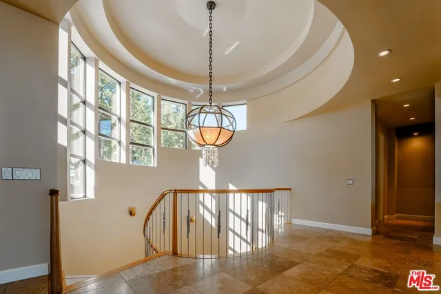 a view of a living room and kitchen with a large window