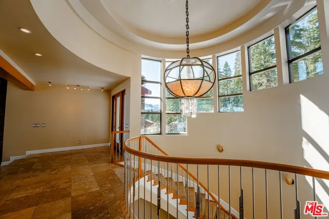 a kitchen with stainless steel appliances granite countertop sink stove and refrigerator
