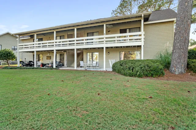 a view of a lake with a house in the background