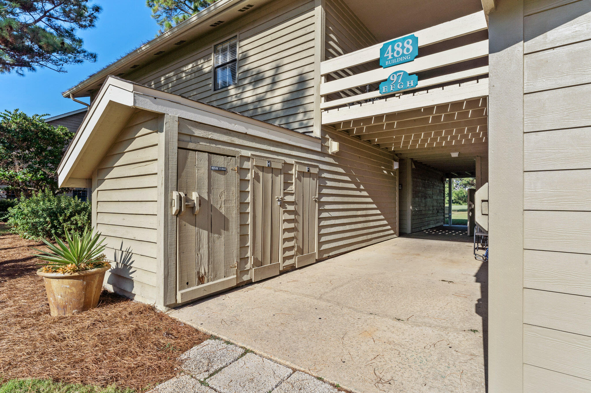 488 North Driftwood Bay, Unit 97F Miramar Beach, FL 32550 - Photo 5 of 31 a view of a house with a potted plant and floor to ceiling window