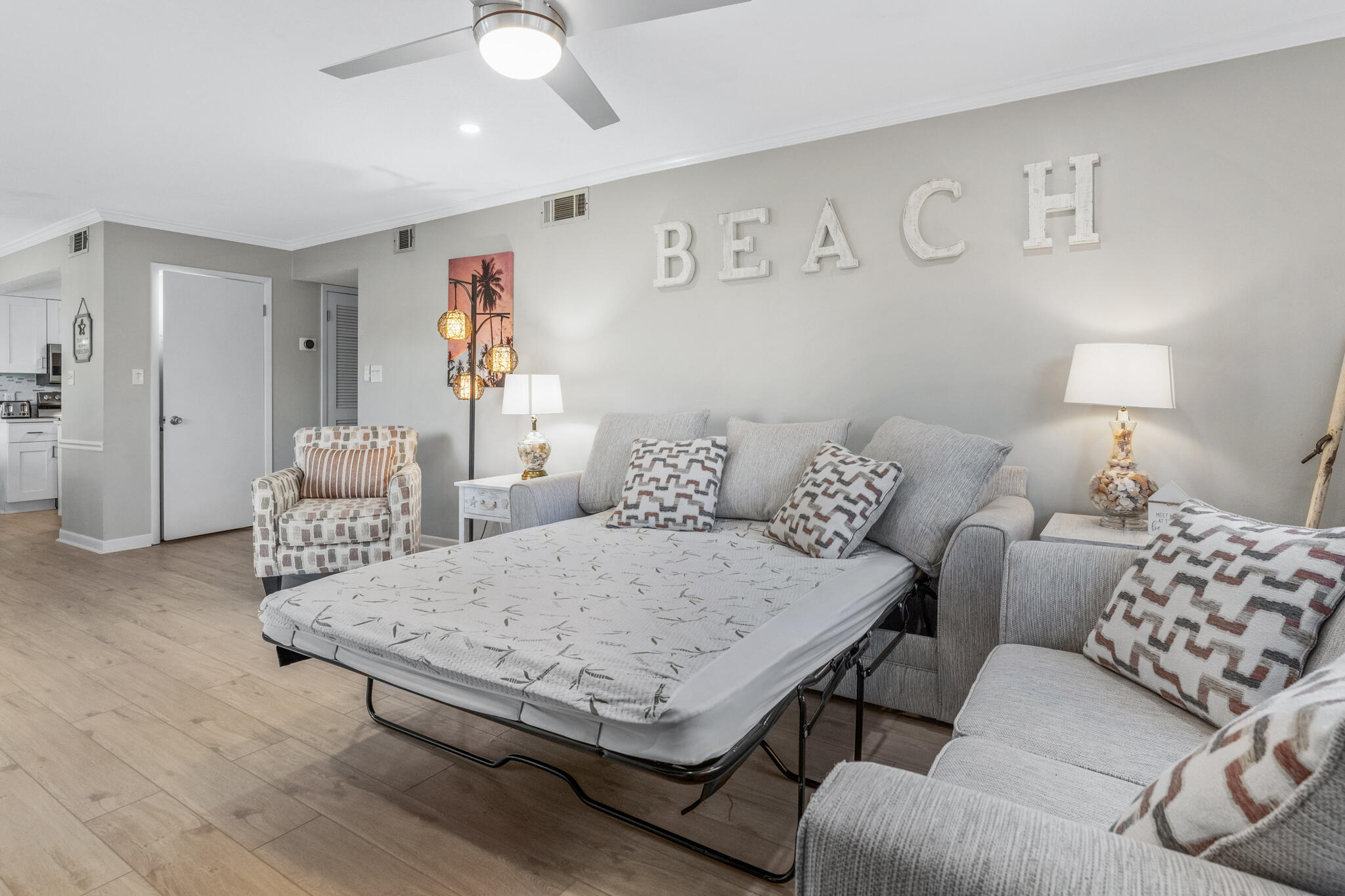 488 North Driftwood Bay, Unit 97F Miramar Beach, FL 32550 - Photo 10 of 31 a living room with furniture and a table