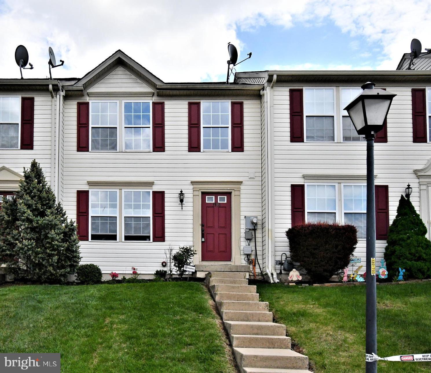 3306 Orchard View Road Reading, PA 19606 - Photo 1 of 16 a front view of a house with a yard and garage