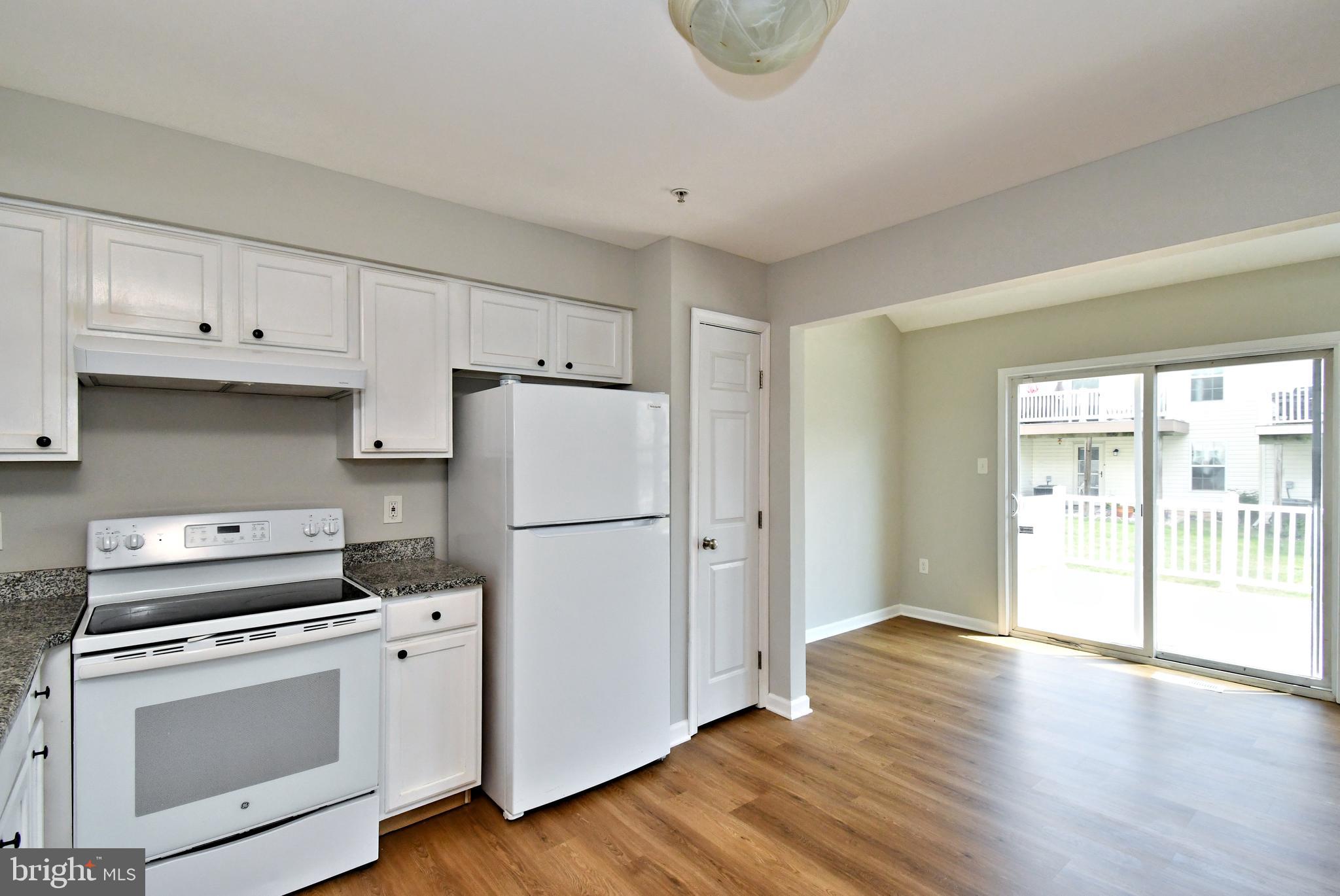 3306 Orchard View Road Reading, PA 19606 - Photo 4 of 16 a kitchen with a refrigerator a stove a microwave and cabinets