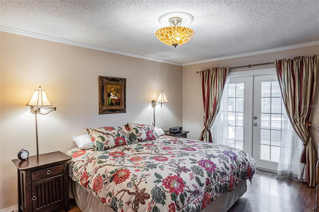 741 Brookside Road Maitland, FL 32751 - Photo 26 of 43 a bedroom with a bed and a lamp