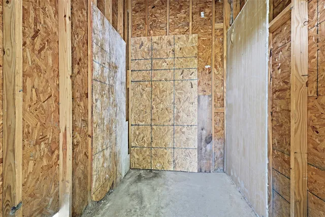a view of a room with chairs and floor to ceiling window