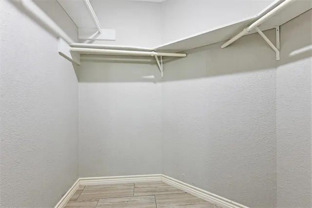 a kitchen with stainless steel appliances white cabinets and a sink