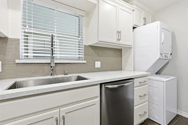 a stove top oven sitting inside of a kitchen