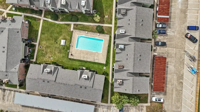 aerial view of a house with a street