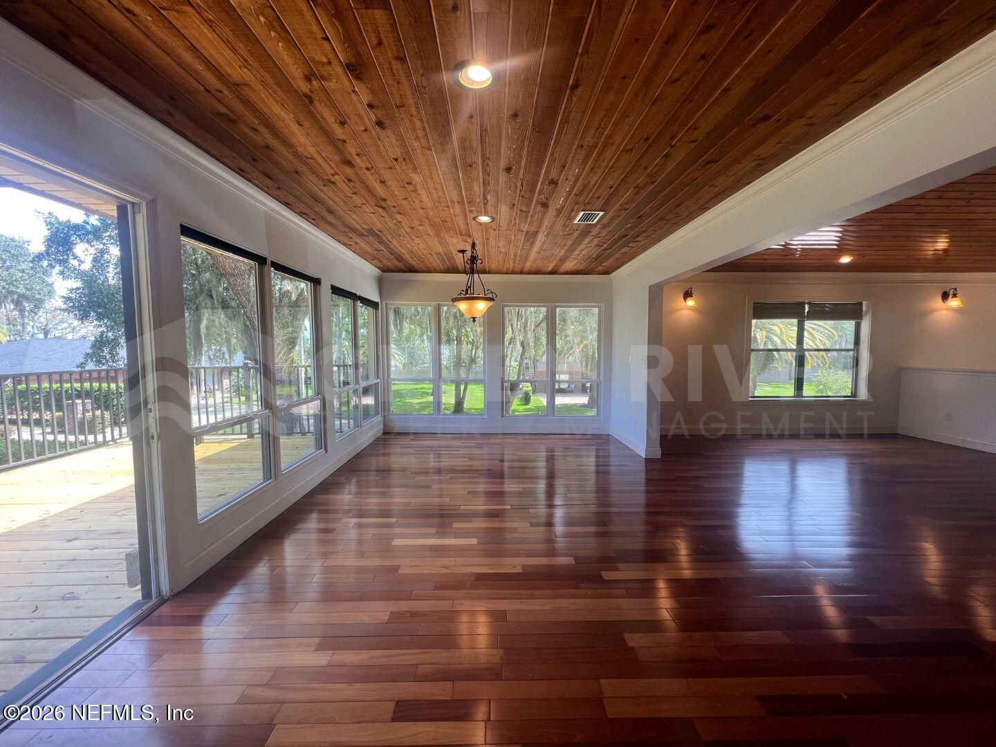 174 Eventide Drive Fleming Island, FL 32003 - Photo 12 of 60 a view of an entryway with wooden floor