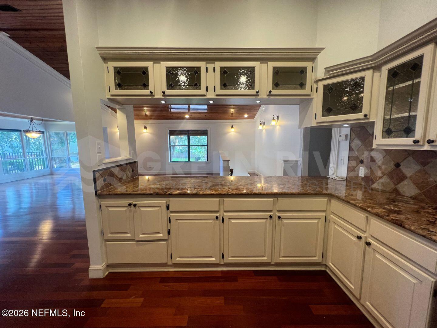 174 Eventide Drive Fleming Island, FL 32003 - Photo 22 of 60 a kitchen with stainless steel appliances granite countertop a sink and cabinets