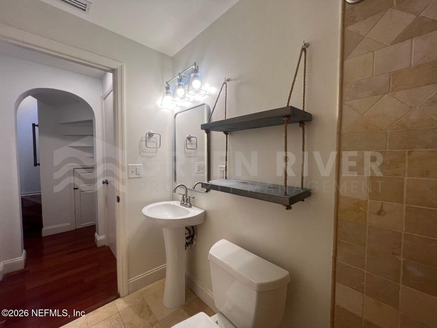 174 Eventide Drive Fleming Island, FL 32003 - Photo 28 of 60 a bathroom with a sink a toilet and shower
