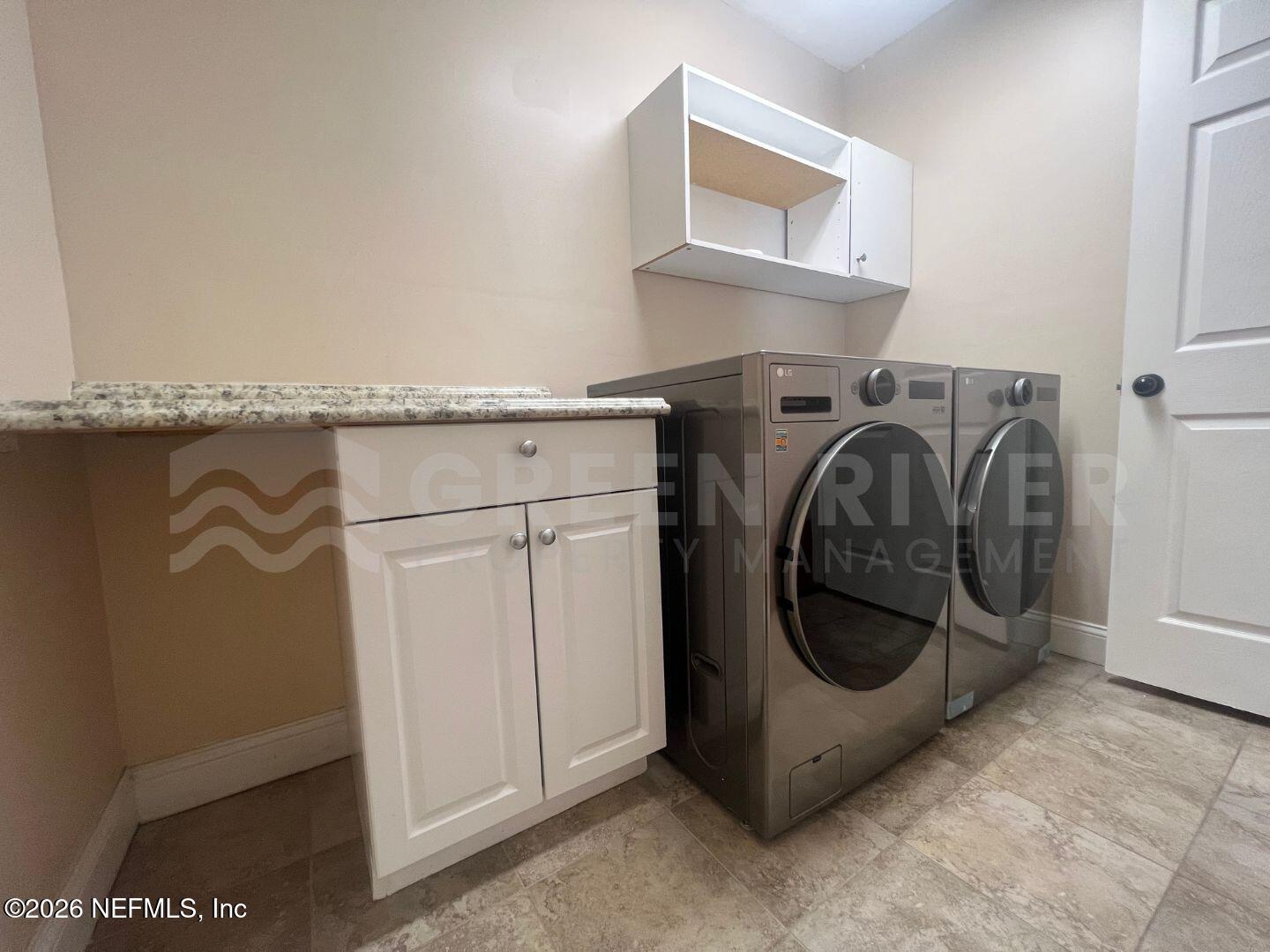 174 Eventide Drive Fleming Island, FL 32003 - Photo 40 of 60 a utility room with dryer and washer