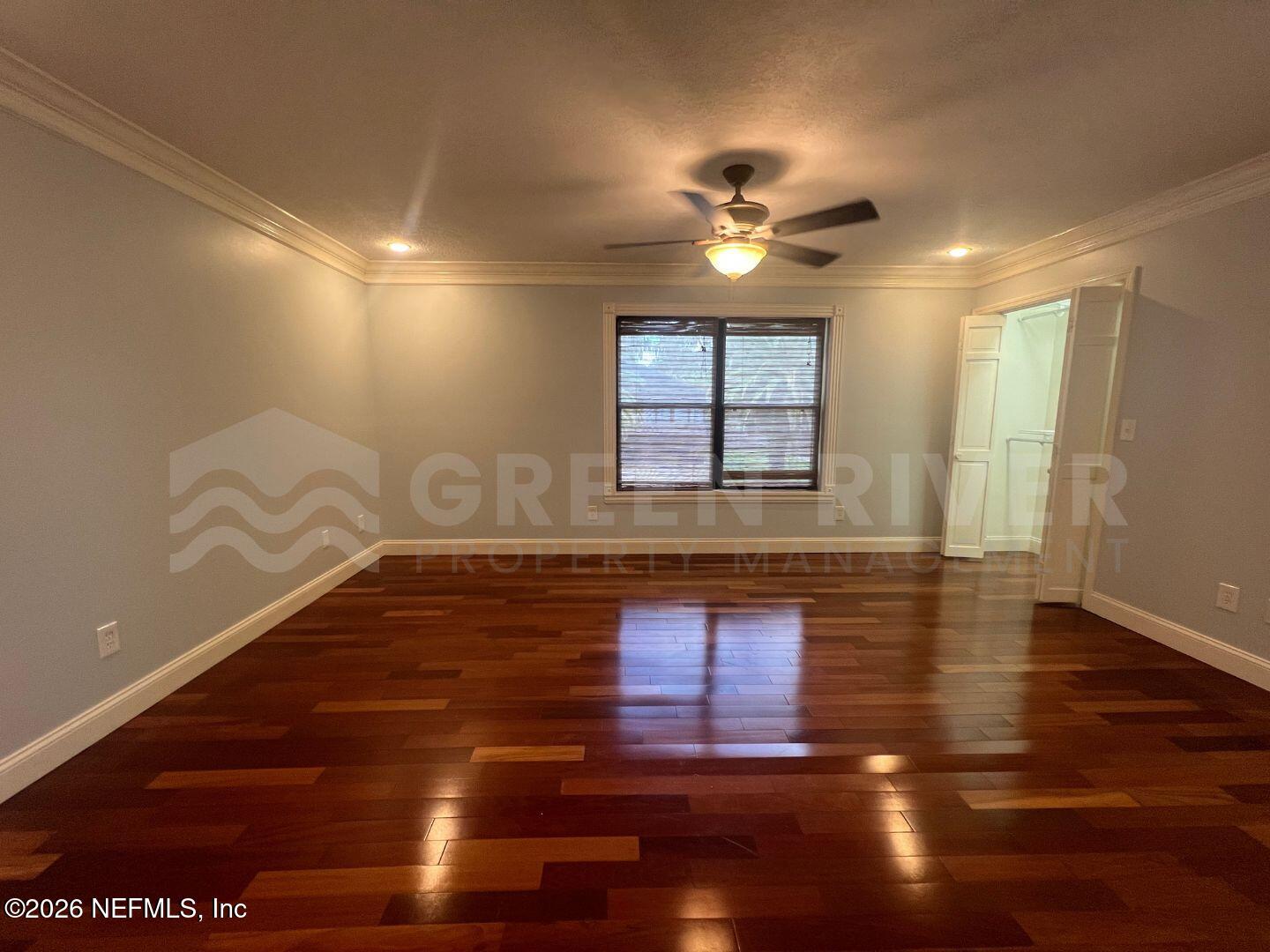 174 Eventide Drive Fleming Island, FL 32003 - Photo 44 of 60 a living room with hard wood floors and a ceiling fan