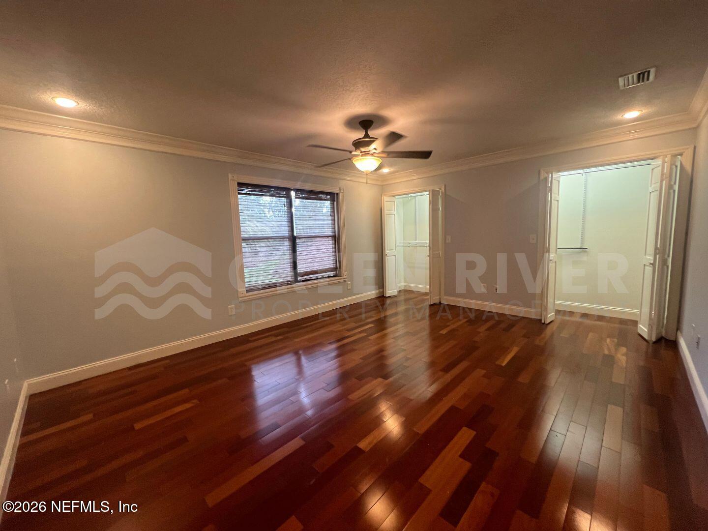 174 Eventide Drive Fleming Island, FL 32003 - Photo 45 of 60 wooden floor in an empty room with a window