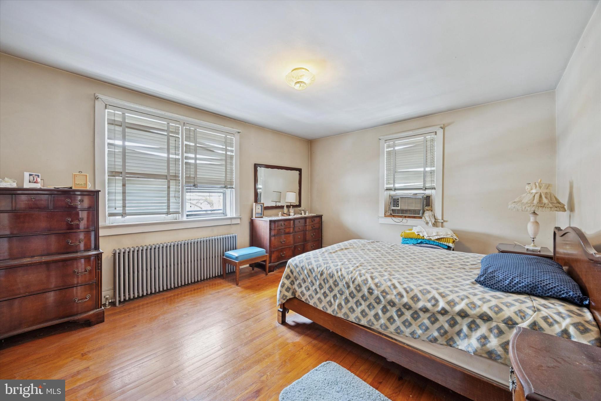104 Monroe Street Bristol, PA 19007 - Photo 11 of 14 Cozy bedroom with warm wooden accents.